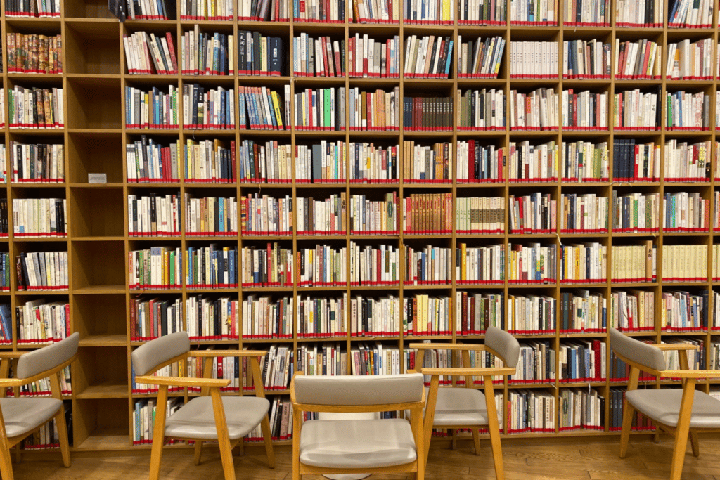 In the library with a wall of books and chairs - Spiritual warfare