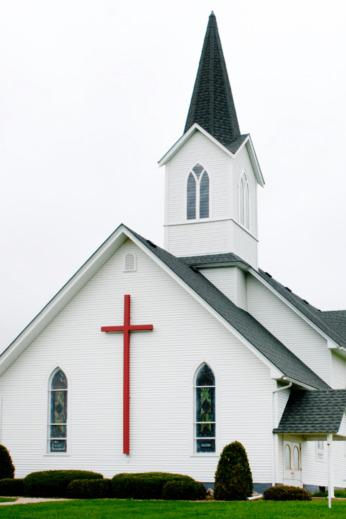 White Church with Red Cross on the front of it