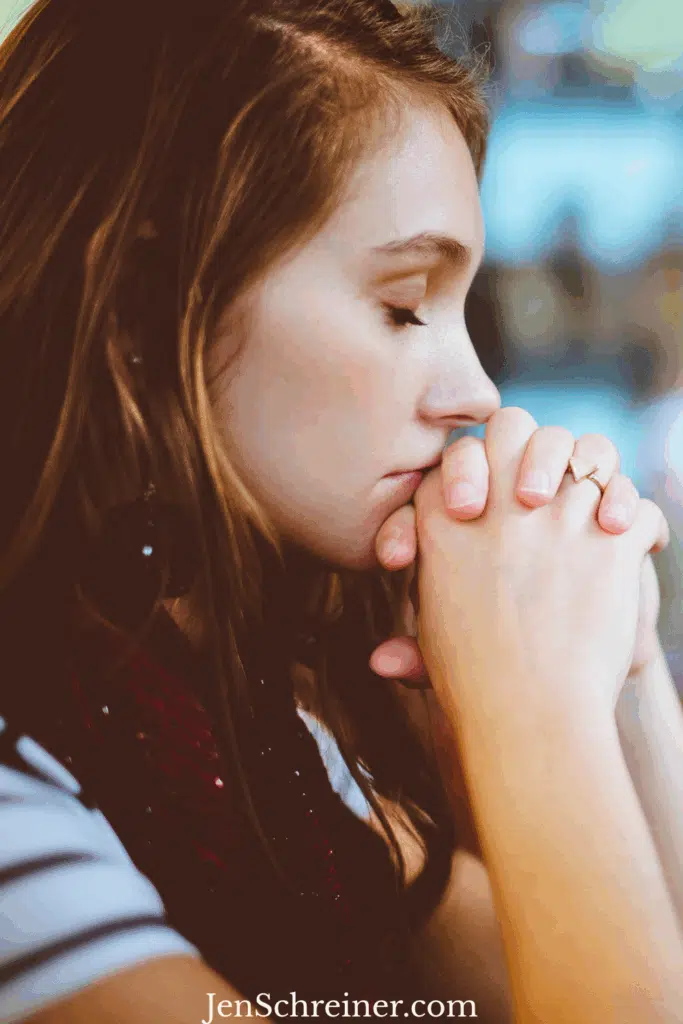 Woman praying in church